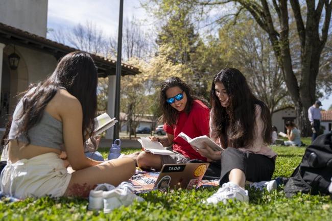 Three students in outdoor genetics class